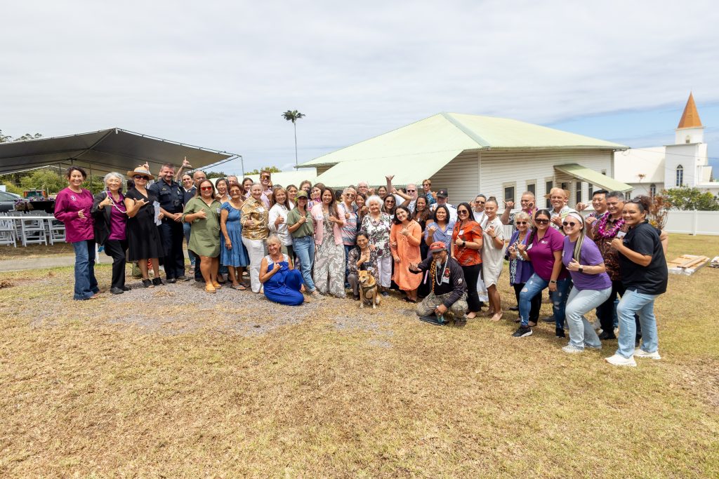 Guests pose with HOPE Services Hawai’i Staff in front of Hale Ulu Lehua.